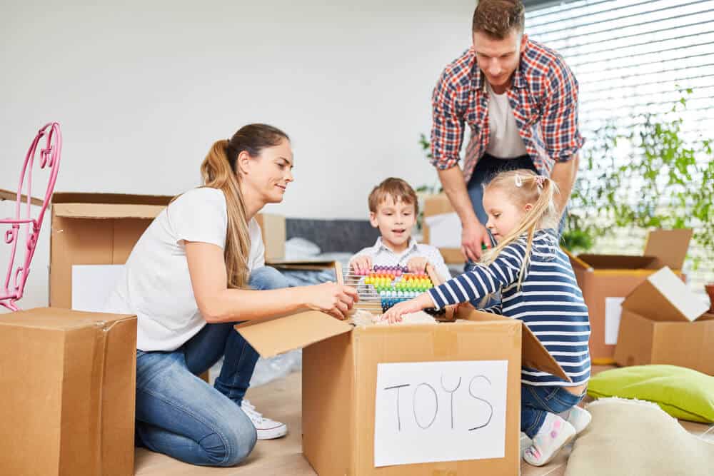 family-packing-toys-in-box
