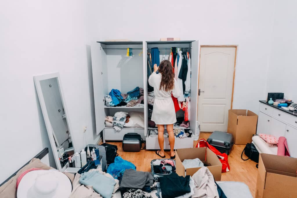Woman decluttering her room