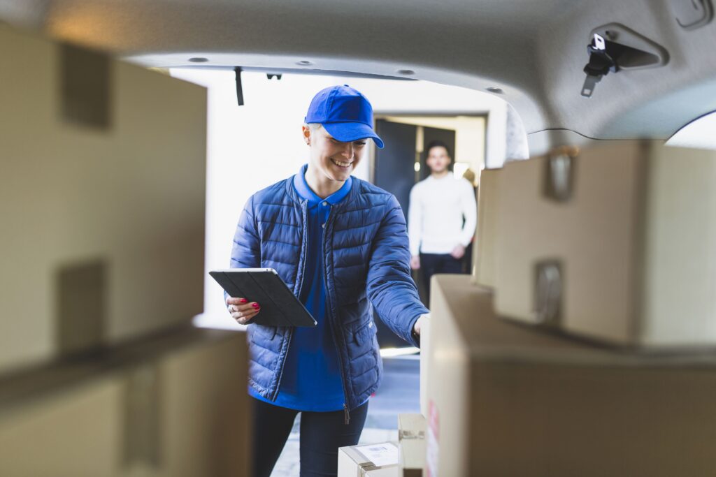 Moving company employee counting boxes