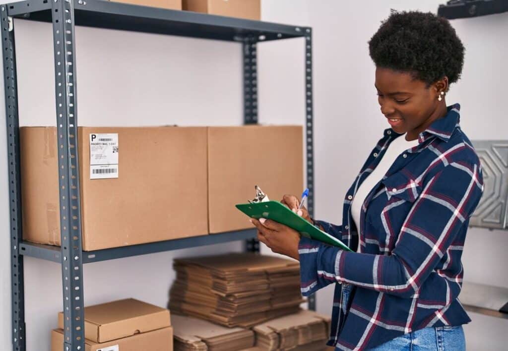 Woman organizing inventory in storage unit