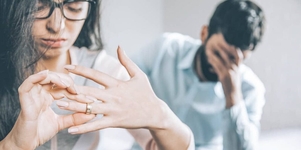 Woman taking off ring